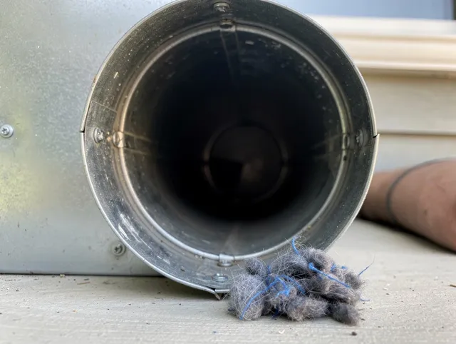 Eastvale Dryer Vent Cleaning technician using specialized equipment to clear severe dryer vent blockage in Eastvale